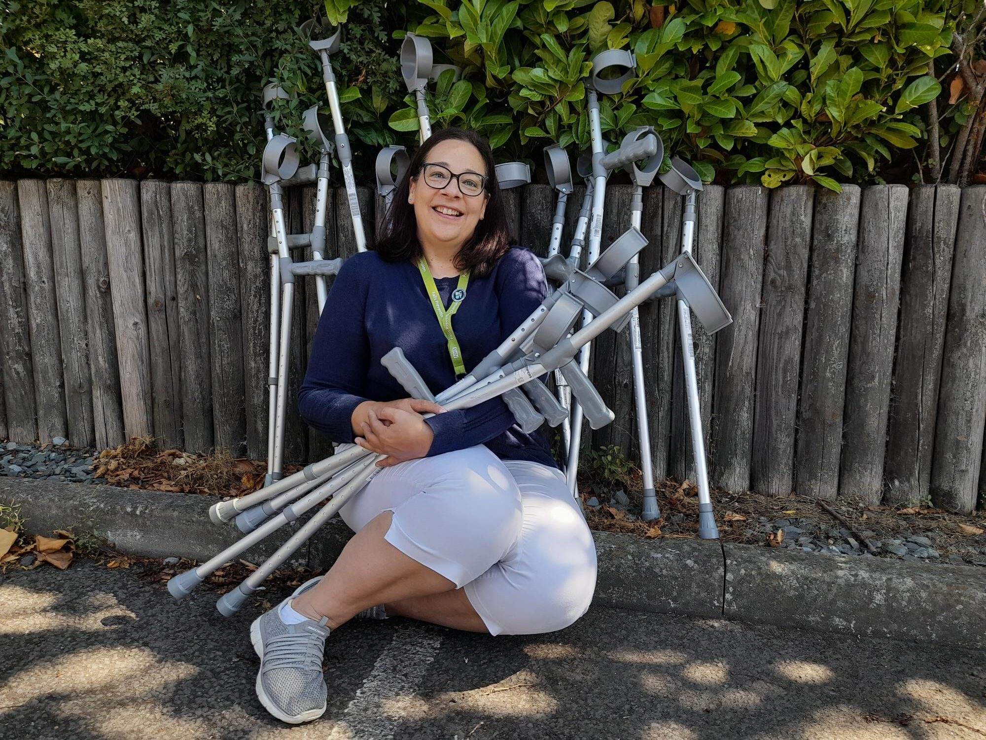 Occupational therapist manager Shirley Rashid, with a stock of elbow crutches