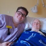 Hydration champion Joseph Bridger with patient Alan Hyde at Hawkhurst Hospital